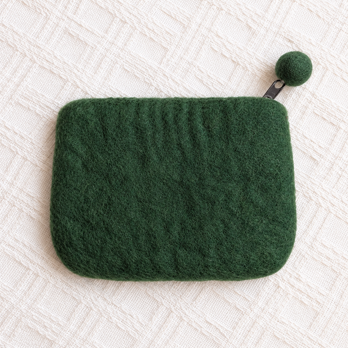 Plain back of green floral felt sheep coin purse with pom-pom zip pull