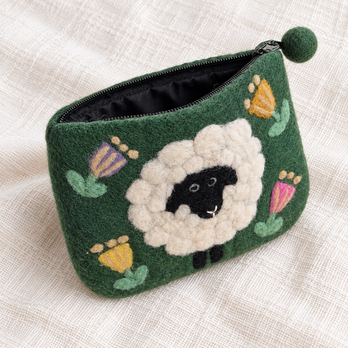 Open green floral felt sheep coin purse showing black zip and lining