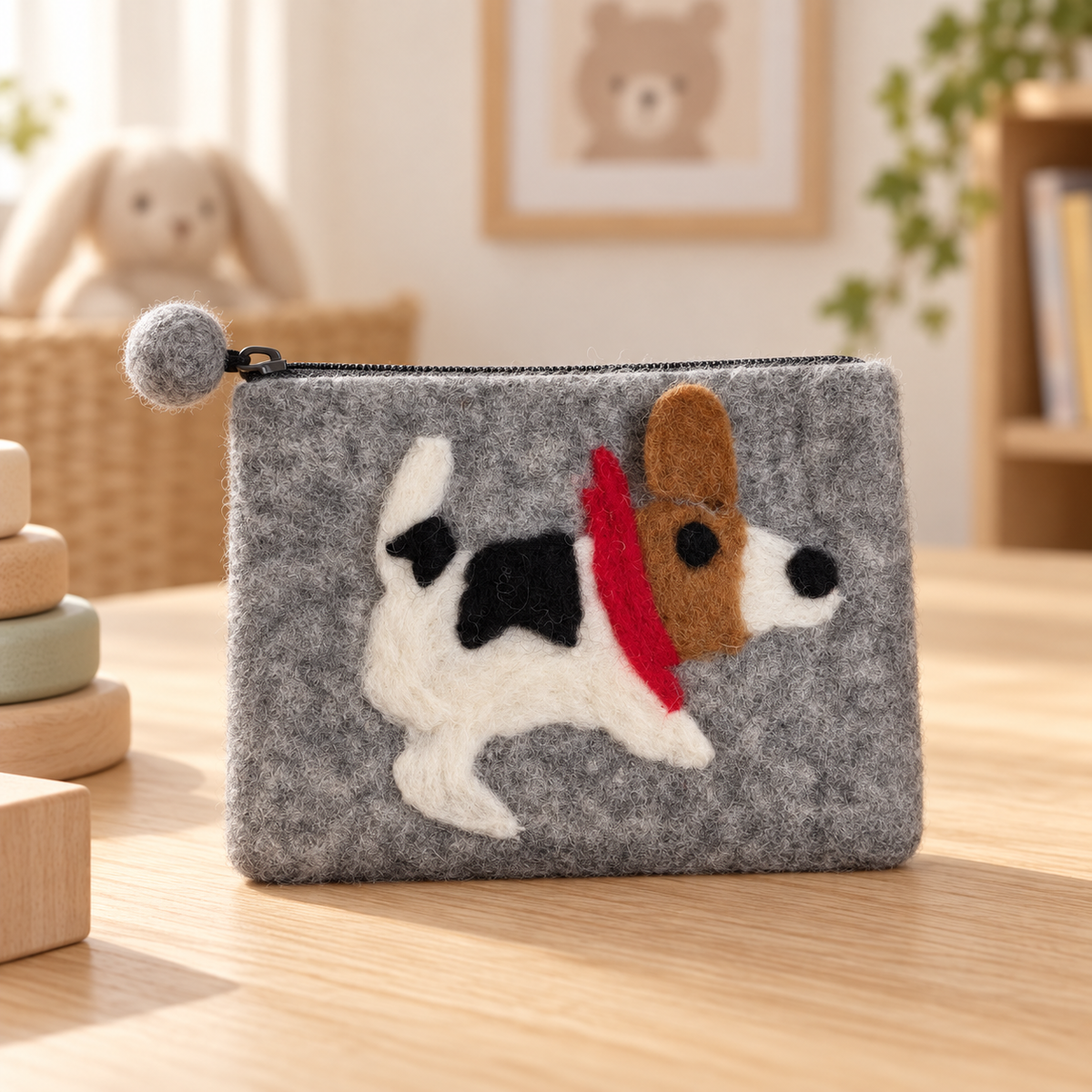Grey spotted dog felt coin purse in a warm nursery setting