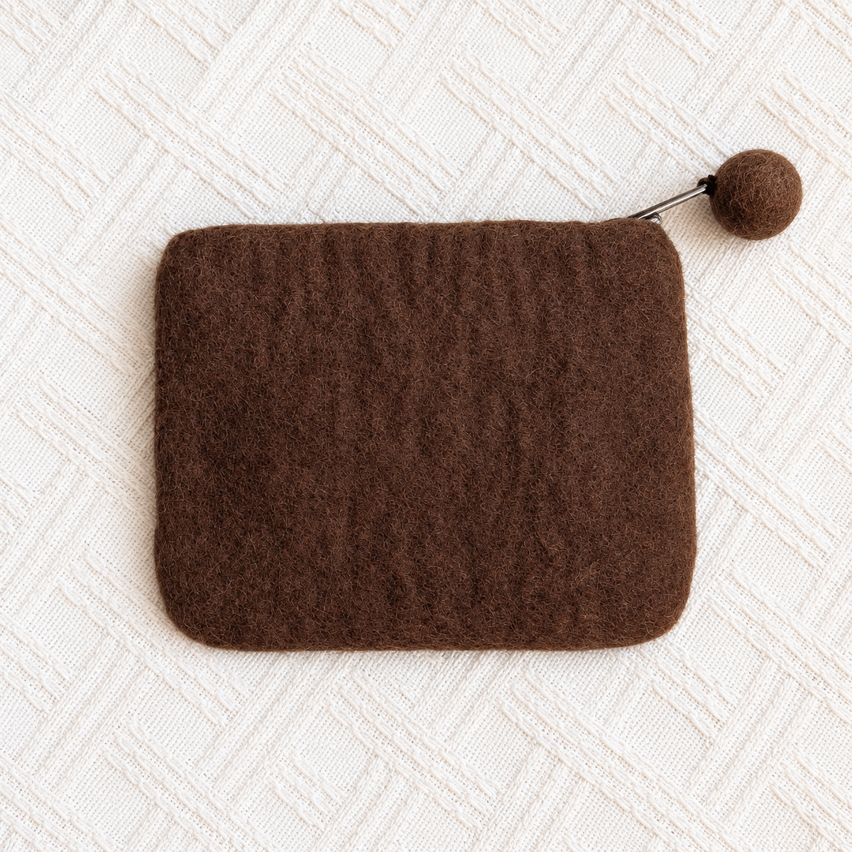 Plain back of brown felt rocking horse coin purse with pom-pom zip pull